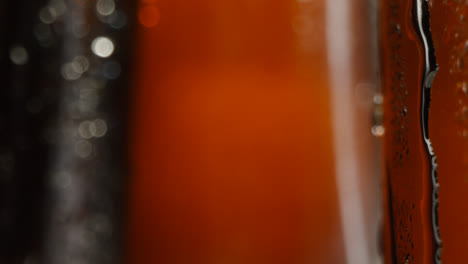 Close-Up-Of-Condensation-Droplets-Running-Down-Bottles-Of-Cold-Beer-Or-Soft-Drinks-1